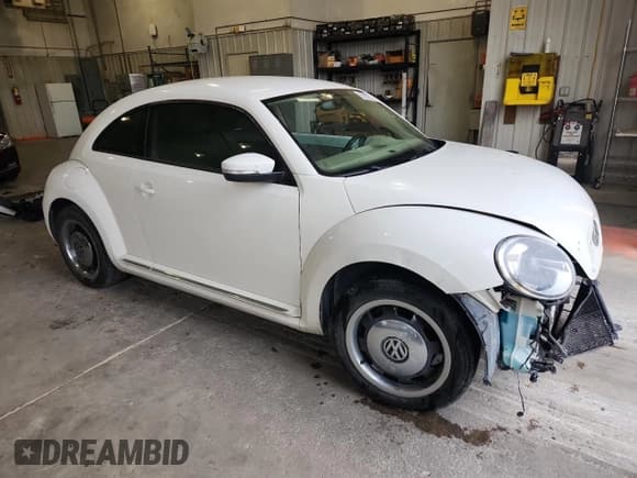 ✅ 2013 Volkswagen Beetle 2.5L • VIN: 3VWJX7AT1DM632703 • Lot: 92857275. Listed on Copart with 144,477 mi. Free auction sales archive from the USA and detailed vehicle history report at DreamBid. Image 4.