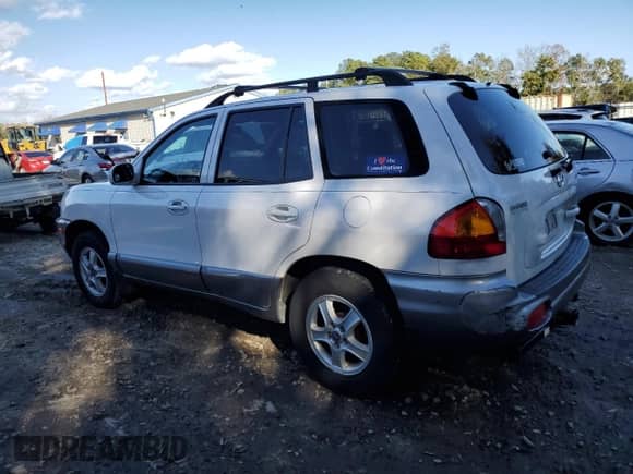 2001 Hyundai Santa Fe GLS z VIN KM8SC83D91U084712, wystawiony jako Copart lot #87107674 z przebiegiem 111 465 mil mil oraz Czysty tytuł • Clean title. Historia ofert i sprzedaży dostępna na DreamBid. Obrazek 2.