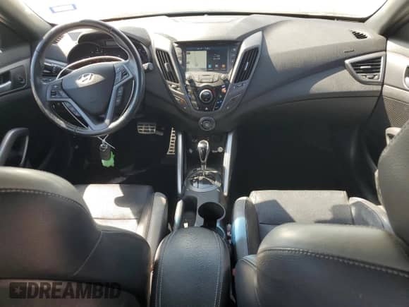 2016 Hyundai Veloster Turbo с VIN KMHTC6AE4GU296124, выставлен на аукционе Copart как лот 82507755 с пробегом 93 957 миль миль и Списание • Salvage title. История ставок и продаж доступна на DreamBid. Изображение 8.