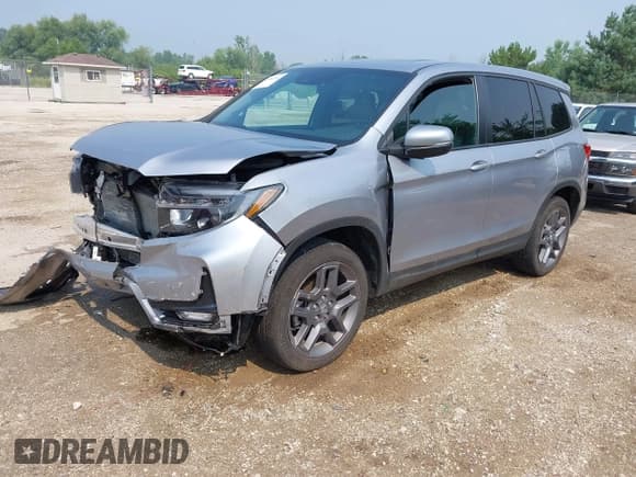 ✅ 2023 Honda Passport EX-L • VIN: 5FNYF8H50PB019594 • Lot: 42882366. Listed on IAAI with 26,120 mi. Free auction sales archive from the USA and detailed vehicle history report at DreamBid. Image 2.