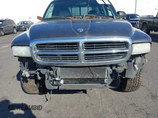 ✅ 2004 Dodge Dakota SLT • VIN: 1D7HG42KX4S748730 • Lot: 41687614. Wystawiony na IAAI z przebiegiem 157 132 mil. Bezpłatny archiwum sprzedaży aukcyjnych z USA i szczegółowy raport historii pojazdu na DreamBid. Zdjęcie 6.