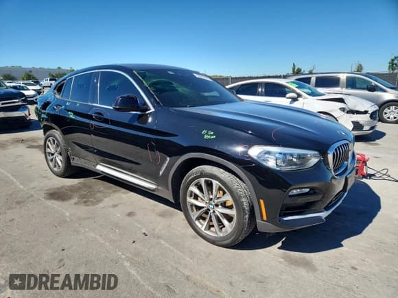 ✅ 2019 BMW X4 xDrive30i • VIN: 5UXUJ3C56KLG56035 • Лот: 90992445. Опубликован ранее на Copart с пробегом 104 242 миль. Бесплатный доступ к архиву аукционных продаж из США и подробный отчёт об истории автомобиля на DreamBid. Изображение 4.
