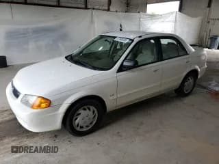 ✅ 1999 Mazda Protege DX • VIN: JM1BJ2224X0173126 • Lot: 57389245. Wystawiony na Copart z przebiegiem 155 534 mil. Bezpłatny archiwum sprzedaży aukcyjnych z USA i szczegółowy raport historii pojazdu na DreamBid. Zdjęcie 1.