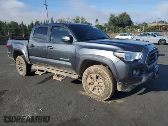 2022 Toyota Tacoma SR5 with VIN 3TMAZ5CN1NM186280, listed as a Copart auction lot 86409735 with 38,852 mi miles and Salvage title. Bid and sale history available at DreamBid. Image 4.