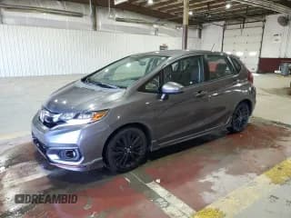 ✅ 2018 Honda Fit Sport • VIN: 3HGGK5H64JM713028 • Лот: 90338475. Опубликован ранее на Copart с пробегом 54 176 миль. Бесплатный доступ к архиву аукционных продаж из США и подробный отчёт об истории автомобиля на DreamBid. Изображение 1.