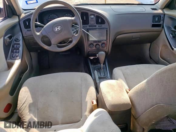2004 Hyundai Elantra GLS with VIN KMHDN46D24U728241, listed as a Copart auction lot 68002955 with 242,945 mi miles and Salvage title. Bid and sale history available at DreamBid. Image 8.