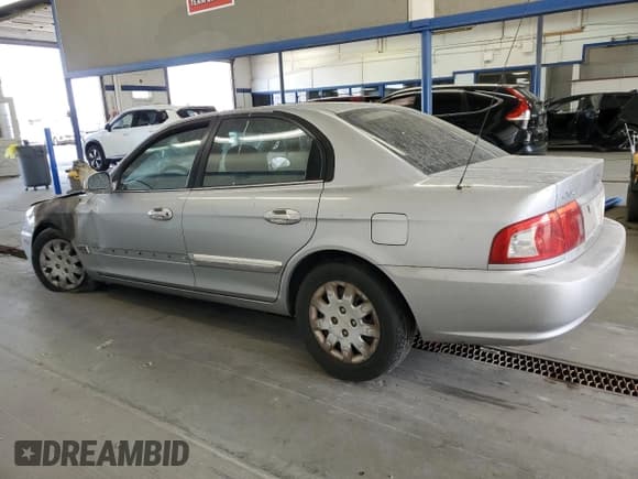 ✅ 2003 Kia Optima LX • VIN: KNAGD126335211255 • Лот: 60637665. Опубликован ранее на Copart с пробегом Не указан. Бесплатный доступ к архиву аукционных продаж из США и подробный отчёт об истории автомобиля на DreamBid. Изображение 2.