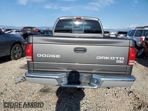 2004 Dodge Dakota SLT z VIN 1D7HG48N24S594161, wystawiony jako Copart lot #71238164 z przebiegiem Nie podano mil oraz Szkoda całkowita • Salvage title. Historia ofert i sprzedaży dostępna na DreamBid. Obrazek 6.