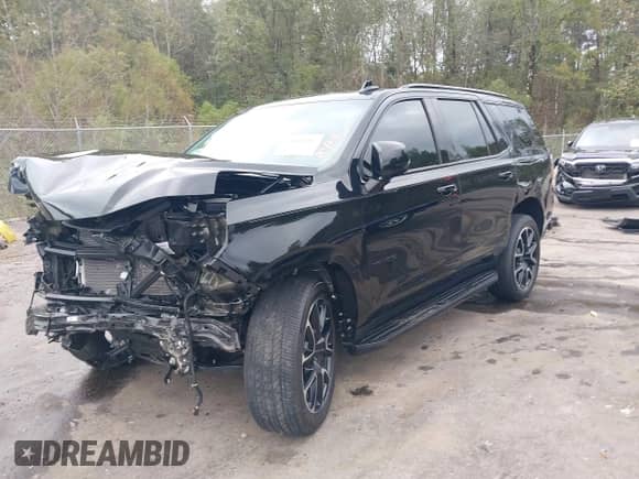 2024 Chevrolet Tahoe RST z VIN 1GNSCRKD0RR302733, wystawiony jako IAAI lot #40800083 z przebiegiem 10 597 mil mil oraz . Historia ofert i sprzedaży dostępna na DreamBid. Obrazek 20.