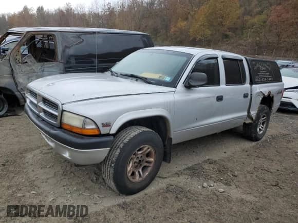 2004 Dodge Dakota Sport z VIN 1D7HG38N54S731040, wystawiony jako Copart lot #78125744 z przebiegiem 249 049 mil mil oraz Szkoda całkowita • Salvage title. Historia ofert i sprzedaży dostępna na DreamBid. Obrazek 1.