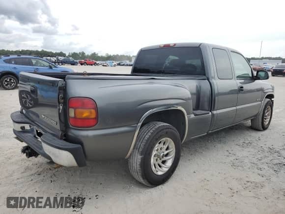 2002 Chevrolet Silverado 1500 LS z VIN 2GCEC19T921344756, wystawiony jako Copart lot #72798354 z przebiegiem 157 700 mil mil oraz Szkoda całkowita • Salvage title. Historia ofert i sprzedaży dostępna na DreamBid. Obrazek 3.