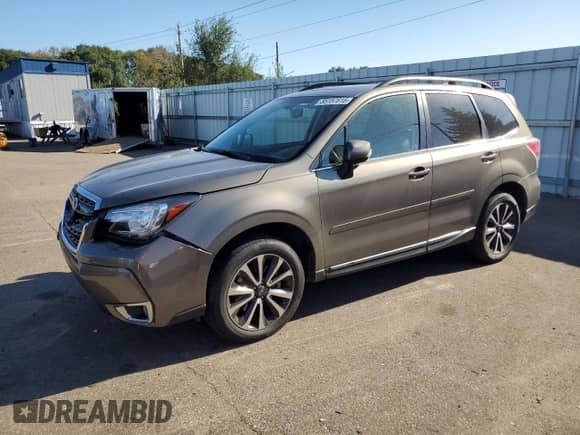 2017 Subaru Forester Touring с VIN JF2SJGWC4HH585860, выставлен на аукционе Copart как лот 85157815 с пробегом 89 784 миль миль и Списание • Salvage title. История ставок и продаж доступна на DreamBid. Изображение 1.