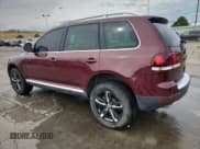 ✅ 2010 Volkswagen Touareg V6 • VIN: WVGFK7A93AD001661 • Lot: 81596405. Listed on Copart with 124,220 mi. Free auction sales archive from the USA and detailed vehicle history report at DreamBid. Image 2.