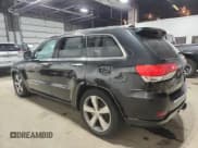 ✅ 2014 Jeep Grand Cherokee Overland • VIN: 1C4RJFCG9EC339863 • Lot: 90741315. Listed on Copart with 143,485 mi. Free auction sales archive from the USA and detailed vehicle history report at DreamBid. Image 2.