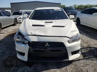 ✅ 2014 Mitsubishi Lancer Evolution GSR • VIN: JA32W8FV6EU017487 • Lot: 52066995. Listed on Copart with 44,332 mi. Free auction sales archive from the USA and detailed vehicle history report at DreamBid. Image 5.