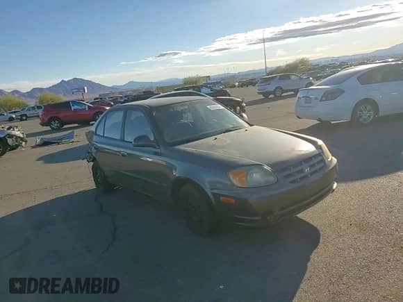 2005 Hyundai Accent GLS with VIN KMHCG45C95U665574, listed as a Copart auction lot 82603804 with 154,187 mi miles and Salvage title. Bid and sale history available at DreamBid. Image 11.