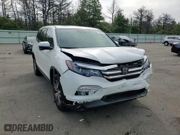 ✅ 2017 Honda Pilot EX-L • VIN: 5FNYF6H68HB075734 • Lot: 71950575. Listed on Copart with 80,157 mi. Free auction sales archive from the USA and detailed vehicle history report at DreamBid. Image 14.