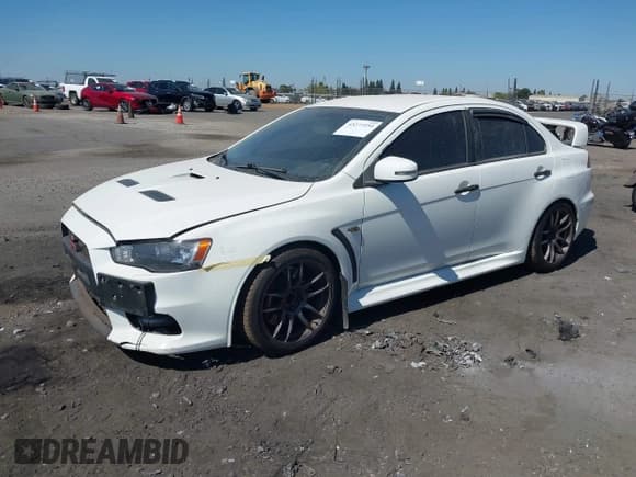 ✅ 2015 Mitsubishi Lancer Evolution GSR • VIN: JA32W8FV6FU017796 • Lot: 43277254. Wystawiony na IAAI z przebiegiem 149 416 mil. Bezpłatny archiwum sprzedaży aukcyjnych z USA i szczegółowy raport historii pojazdu na DreamBid. Zdjęcie 2.