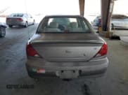 ✅ 2003 Kia Spectra • VIN: KNAFB121535290126 • Lot: 64215785. Listed on Copart with 184,598 mi. Free auction sales archive from the USA and detailed vehicle history report at DreamBid. Image 6.