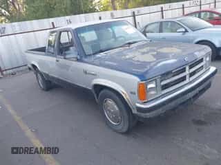 1990 Dodge Dakota z VIN 1B7GL23XXLS658752, wystawiony jako IAAI lot #42627157 z przebiegiem 133 205 mil mil oraz . Historia ofert i sprzedaży dostępna na DreamBid. Obrazek 1.