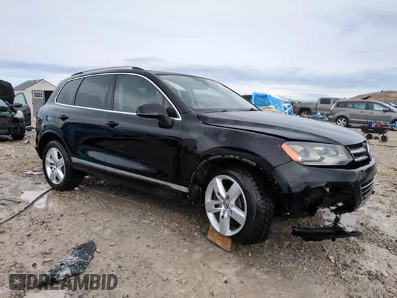 ✅ 2013 Volkswagen Touareg Exec • VIN: WVGEF9BP3DD001656 • Lot: 49436605. Listed on Copart with 186,277 mi. Free auction sales archive from the USA and detailed vehicle history report at DreamBid. Image 13.