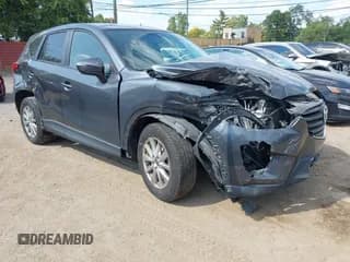✅ 2016 Mazda CX-5 Touring • VIN: JM3KE4CY3G0661445 • Lot: 43248250. Wystawiony na IAAI z przebiegiem 111 403 mil. Bezpłatny archiwum sprzedaży aukcyjnych z USA i szczegółowy raport historii pojazdu na DreamBid. Zdjęcie 1.