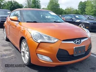 ✅ 2013 Hyundai Veloster w/Black Int • VIN: KMHTC6AD4DU169568 • Lot: 42483730. Wystawiony na IAAI z przebiegiem 214 625 mil. Bezpłatny archiwum sprzedaży aukcyjnych z USA i szczegółowy raport historii pojazdu na DreamBid. Zdjęcie 1.