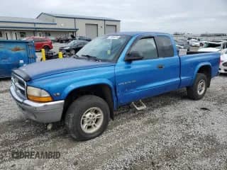 1999 Dodge Dakota SLT z VIN 1B7GG22X0XS285930, wystawiony jako Copart lot #79294374 z przebiegiem 189 988 mil mil oraz Nie do naprawy • Non repairable. Historia ofert i sprzedaży dostępna na DreamBid. Obrazek 1.