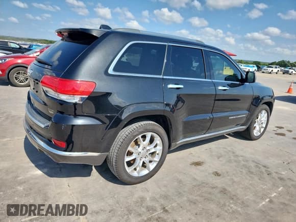 ✅ 2014 Jeep Grand Cherokee • VIN: 1C4RJEJMXEC585632 • Lot: 62036515. Listed on Copart with 148,660 mi. Free auction sales archive from the USA and detailed vehicle history report at DreamBid. Image 3.