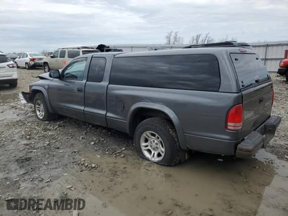 2004 Dodge Dakota Sport z VIN 1D7GL32NX4S584715, wystawiony jako Copart lot #54146225 z przebiegiem Nie podano mil oraz Nie do naprawy • Non repairable. Historia ofert i sprzedaży dostępna na DreamBid. Obrazek 2.