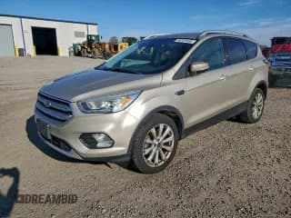 ✅ 2017 Ford Escape Titanium • VIN: 1FMCU0JD7HUB86512 • Lot: 96520485. Wystawiony na Copart z przebiegiem 202 165 mil. Bezpłatny archiwum sprzedaży aukcyjnych z USA i szczegółowy raport historii pojazdu na DreamBid. Zdjęcie 1.