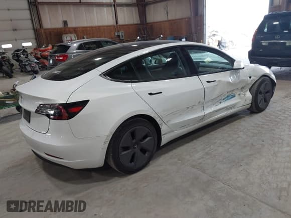 ✅ 2023 Tesla Model 3 • VIN: 5YJ3E1EA8PF501350 • Lot: 42500841. Listed on IAAI with 19,466 mi. Free auction sales archive from the USA and detailed vehicle history report at DreamBid. Image 4.