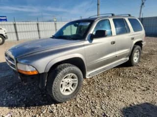 ✅ 2001 Dodge Durango • VIN: 1B4HS28Z31F506574 • Lot: 90736665. Listed on Copart with 185,536 mi. Free auction sales archive from the USA and detailed vehicle history report at DreamBid. Image 1.