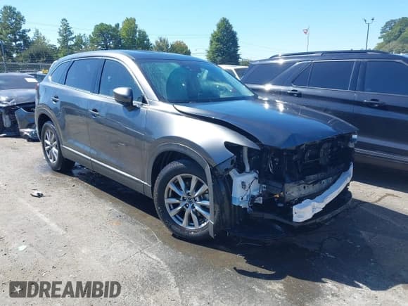 ✅ 2016 Mazda CX-9 Touring • VIN: JM3TCBCY9G0126036 • Lot: 43331708. Listed on IAAI with 64,776 mi. Free auction sales archive from the USA and detailed vehicle history report at DreamBid. Image 1.