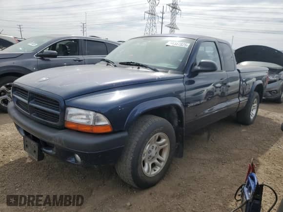 2002 Dodge Dakota Sport z VIN 1B7GL32X12S716897, wystawiony jako Copart lot #54347825 z przebiegiem 85 820 mil mil oraz Czysty tytuł • Clean title. Historia ofert i sprzedaży dostępna na DreamBid. Obrazek 1.