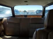 ✅ 1986 Jeep Grand Wagoneer • VIN: 1JCNJ15U0GT147723 • Lot: 69492824. Wystawiony na Copart z przebiegiem 98 610 mil. Bezpłatny archiwum sprzedaży aukcyjnych z USA i szczegółowy raport historii pojazdu na DreamBid. Zdjęcie 10.