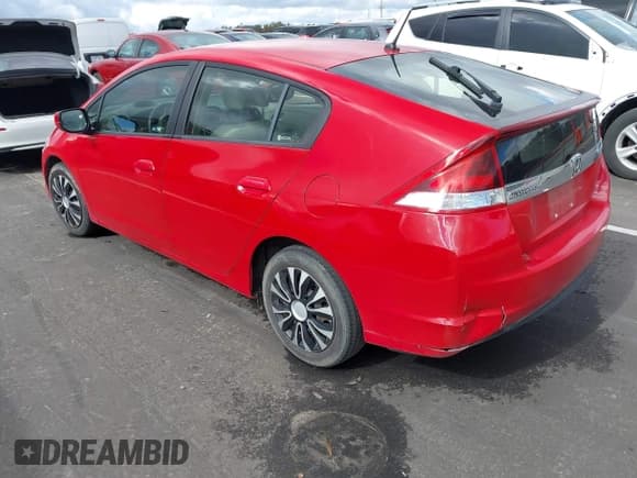 ✅ 2013 Honda Insight • VIN: JHMZE2H30DS003797 • Lot: 43580287. Listed on IAAI with 104,858 mi. Free auction sales archive from the USA and detailed vehicle history report at DreamBid. Image 3.