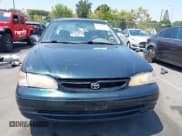 ✅ 1999 Toyota Corolla VE • VIN: 1NXBR12E4XZ251809 • Lot: 42910359. Listed on IAAI with 150,200 mi. Free auction sales archive from the USA and detailed vehicle history report at DreamBid. Image 12.