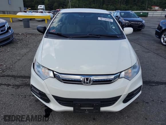 ✅ 2014 Honda Insight • VIN: JHMZE2H35ES002579 • Lot: 70114145. Listed on Copart with 124,514 mi. Free auction sales archive from the USA and detailed vehicle history report at DreamBid. Image 5.