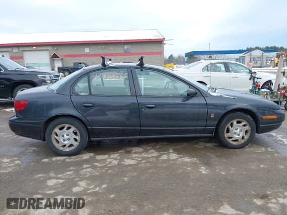 ✅ 2002 Saturn SL • VIN: 1G8ZK527X2Z197969 • Lot: 43824685. Listed on IAAI with 150,270 mi. Free auction sales archive from the USA and detailed vehicle history report at DreamBid. Image 14.