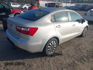 ✅ 2013 Kia Rio LX • VIN: KNADM4A33D6305871 • Lot: 43807224. Listed on IAAI with 124,403 mi. Free auction sales archive from the USA and detailed vehicle history report at DreamBid. Image 4.