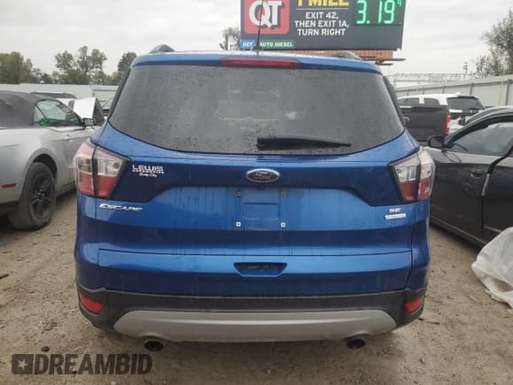 ✅ 2017 Ford Escape SE • VIN: 1FMCU0GD6HUB99582 • Lot: 89511525. Listed on Copart with 127,300 mi. Free auction sales archive from the USA and detailed vehicle history report at DreamBid. Image 6.