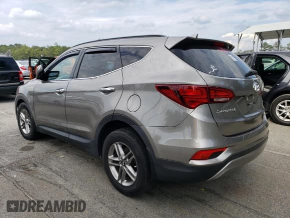 ✅ 2018 Hyundai Santa Fe 2.4L • VIN: 5NMZU3LB2JH069171 • Лот: 67220323. Опубликован ранее на Copart с пробегом 41 400 миль. Бесплатный доступ к архиву аукционных продаж из США и подробный отчёт об истории автомобиля на DreamBid. Изображение 2.