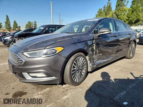 ✅ 2017 Ford Fusion Hybrid Titanium • VIN: 3FA6P0RUXHR260967 • Lot: 90726665. Wystawiony na Copart z przebiegiem 250 880 mil. Bezpłatny archiwum sprzedaży aukcyjnych z USA i szczegółowy raport historii pojazdu na DreamBid. Zdjęcie 1.