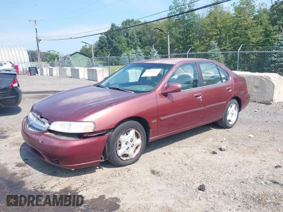 ✅ 2001 Nissan Altima GLE • VIN: 1N4DL01A21C124146 • Lot: 43014267. Listed on IAAI with 104,264 mi. Free auction sales archive from the USA and detailed vehicle history report at DreamBid. Image 2.