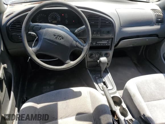 ✅ 2004 Kia Spectra GS • VIN: KNAFB161945141309 • Lot: 52395445. Listed on Copart with 99,100 mi. Free auction sales archive from the USA and detailed vehicle history report at DreamBid. Image 8.