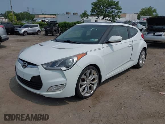 2012 Hyundai Veloster w/Gray Int with VIN KMHTC6AD3CU051395, listed as a IAAI auction lot 42489038 with 153,319 mi miles and . Bid and sale history available at DreamBid. Image 2.