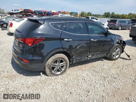 2018 Hyundai Santa Fe 2.4L z VIN 5NMZUDLB0JH058434, wystawiony jako Copart lot #80943575 z przebiegiem 100 658 mil mil oraz Szkoda całkowita • Salvage title. Historia ofert i sprzedaży dostępna na DreamBid. Obrazek 3.