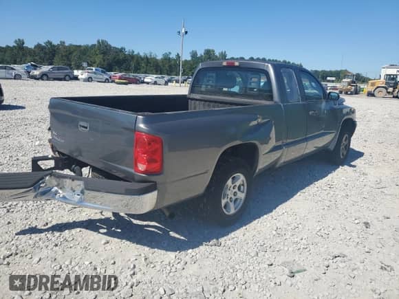 2006 Dodge Dakota SLT с VIN 1D7HE42K96S714075, выставлен на аукционе Copart как лот 75673964 с пробегом 208 571 миль миль и Списание • Salvage title. История ставок и продаж доступна на DreamBid. Изображение 3.