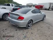 ✅ 2005 Hyundai Tiburon GS • VIN: KMHHM65D85U174335 • Лот: 39373771. Опубликован ранее на IAAI с пробегом 117 296 миль. Бесплатный доступ к архиву аукционных продаж из США и подробный отчёт об истории автомобиля на DreamBid. Изображение 4.